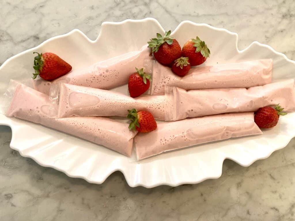 picture of strawberr-banana Greek yogurt tubes on a white tray