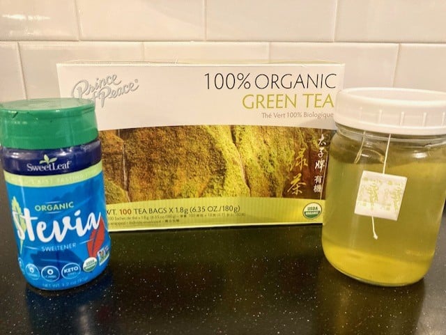 jar of green tea with box and stevia