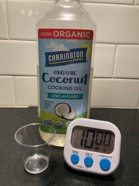 coconut oil, timer, and plastic cup