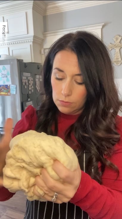 women shaping ball of dough