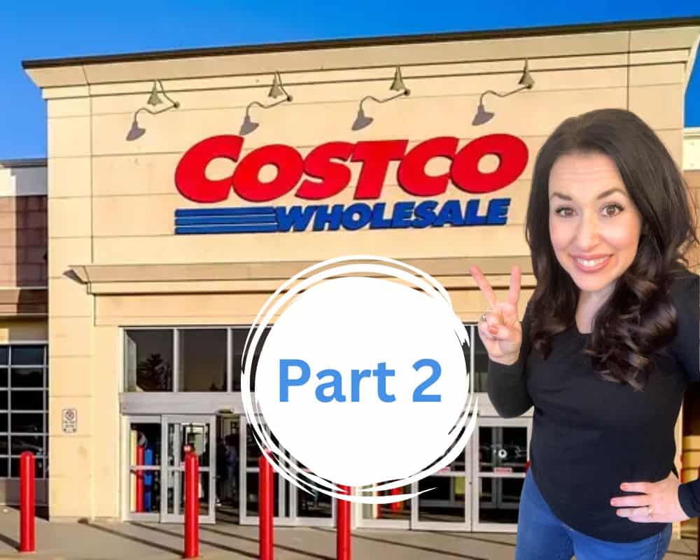 Woman holding up number 2 in front of costco store