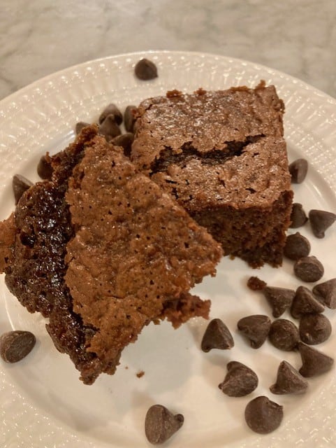 sourdough breakfast brownies on white plate with chocolate chips