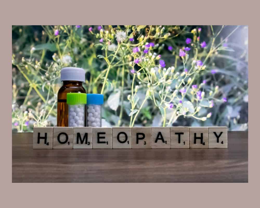 3 vials of homeopathy with letters spelling homeopathy