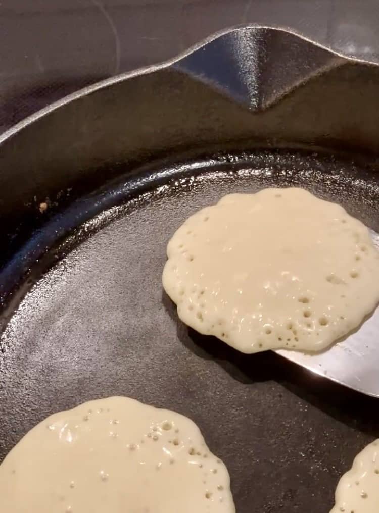 pancake in skillet about to flip