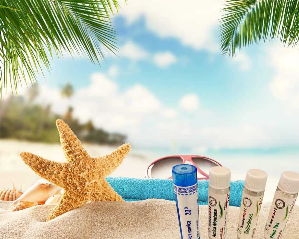 Beach scene with bottles of homeopathic remedies