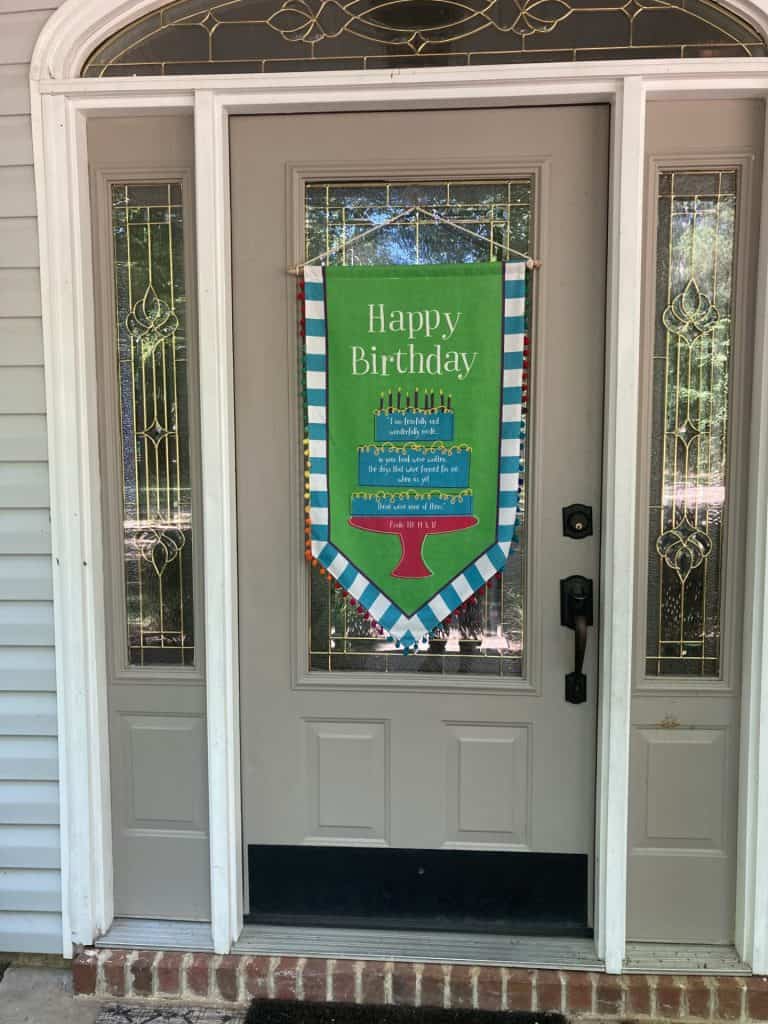 door with birthday banner