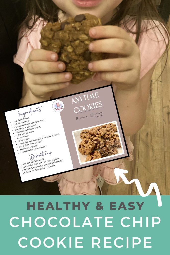 little girl holding cookie